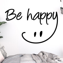 Wallsticker med teksten "Be happy" og en smiley