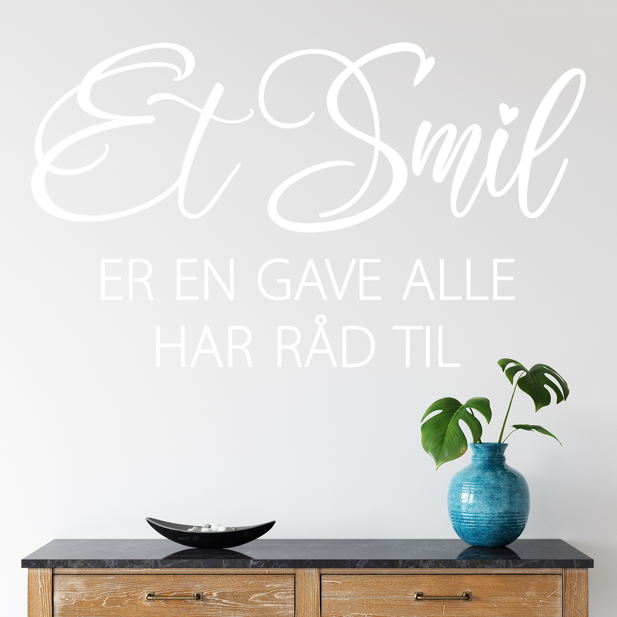 Wallsticker med teksten "Et smil er en gave alle har råd til"