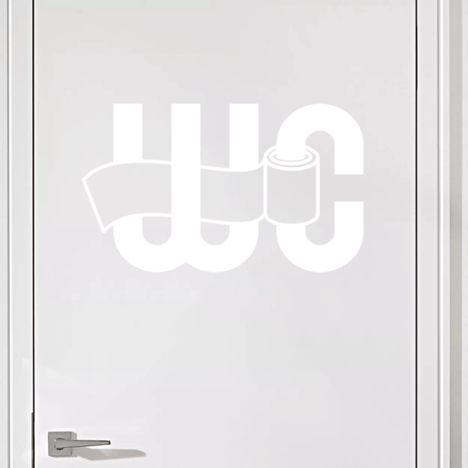 Wallsticker med teksten "WC" hvor der sidder en toiletrulle på C'et