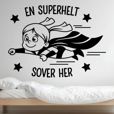 Wallsticker med en superhelt pige og teksten "En superhelt sover her"