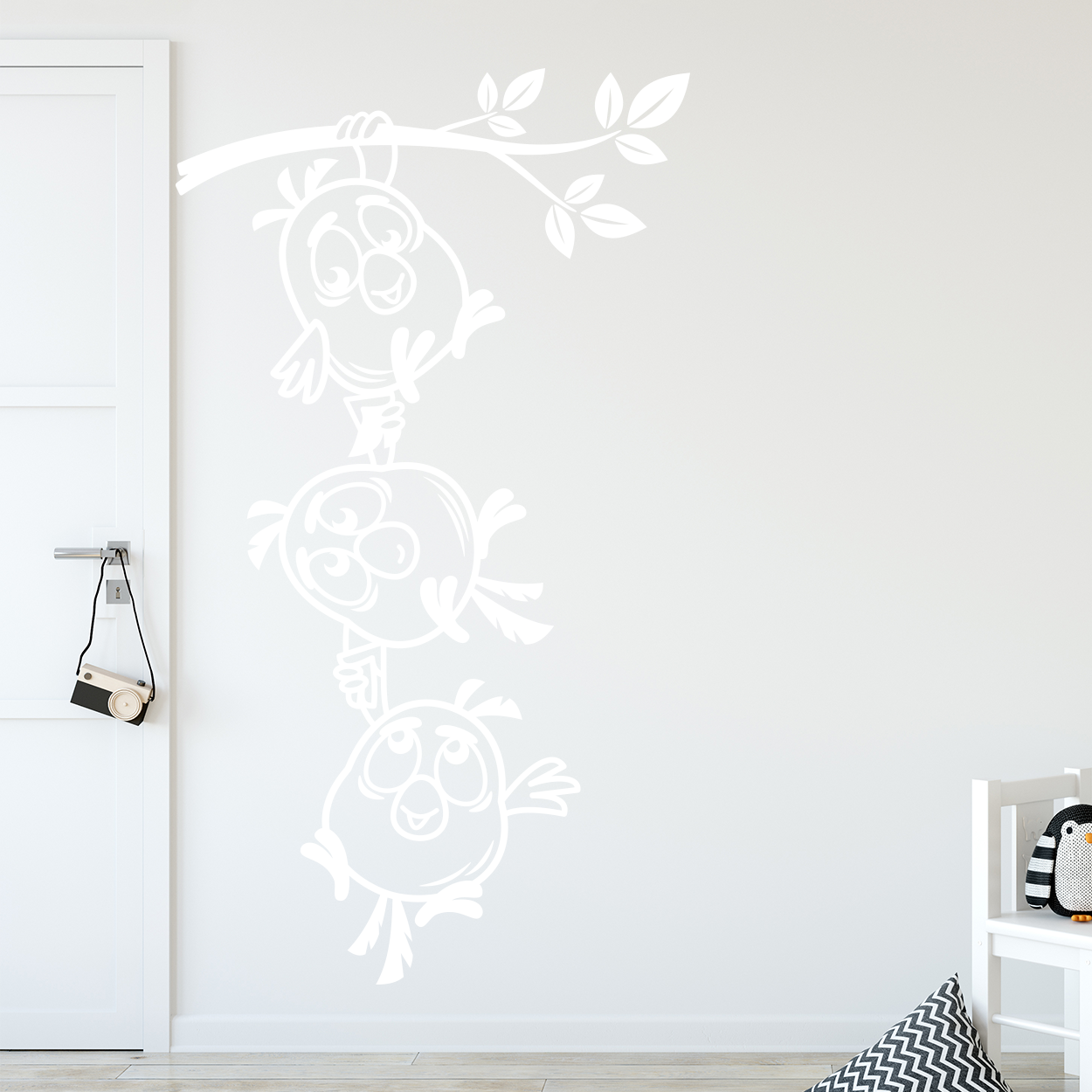 Wallsticker med fugle hænger i gren